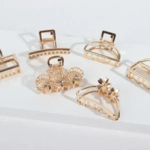 Pinza metalica dorada